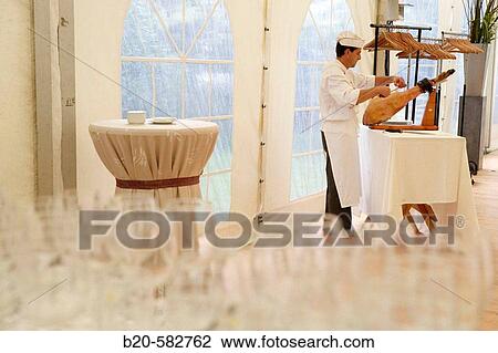 Cutting ham. Wedding. Divinus Catering, San Sebastian, Donostia, Gipuzkoa, Euskadi. Spain. View Large Photo Image Stock Image - Cutting ham. Wedding. Divinus Catering, San Sebastian, Donostia, Gipuzkoa, Euskadi. Spain.. Fotosearch