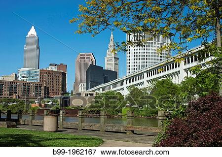 CUYAHOGA RIVER AT SETTLERS LANDING PARK DOWNTOWN SKYLINE CLEVELAND OHIO USA. View Large Photo Image Stock Photo - CUYAHOGA RIVER AT SETTLERS LANDING PARK DOWNTOWN SKYLINE CLEVELAND OHIO USA.. Fotosearch