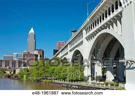 CUYAHOGA RIVER AT SETTLERS LANDING PARK DOWNTOWN SKYLINE CLEVELAND OHIO USA. View Large Photo Image Stock Photo - CUYAHOGA RIVER AT SETTLERS LANDING PARK DOWNTOWN SKYLINE CLEVELAND OHIO USA.. Fotosearch