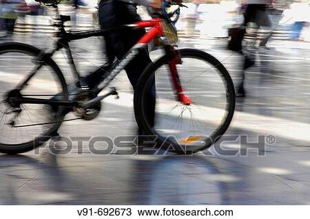Cyclist crossing square, Valencia. Comunidad Valenciana, Spain (March 2006) View Large Photo Image Stock Image - Cyclist crossing square, Valencia. Comunidad Valenciana, Spain (March 2006). Fotosearch