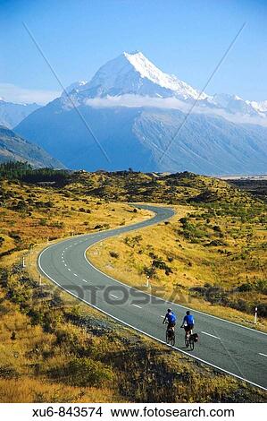 Picture - Cyclist riding to Mt Cook New Zealand. Fotosearch