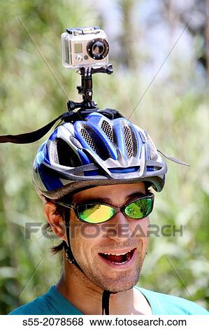 Cyclist with video camera, Via Verde Girona-St. Feliu de Guixols, Catalonia, Spain. View Large Photo Image Stock Photo - Cyclist with video camera, Via Verde Girona-St. Feliu de Guixols, Catalonia, Spain.. Fotosearch