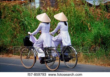 Cyclists, Vietnam View Large Photo Image Stock Image - Cyclists, Vietnam. Fotosearch