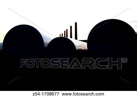 Stock Photo - Cylinder wind power and chimneis. Fotosearch