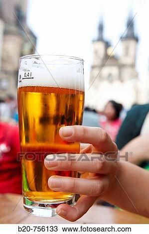 Stock Image - Czech beer and Tyn church in background, Staromestske Namesti (Old Town Square), Prague, Czech Republic. Fotosearch