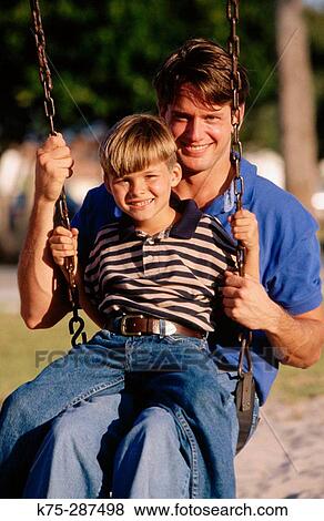 Stock Photo - dad and son on swing. Fotosearch