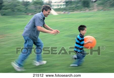 Dad chasing son View Large Photo Image Stock Image - Dad chasing son. Fotosearch