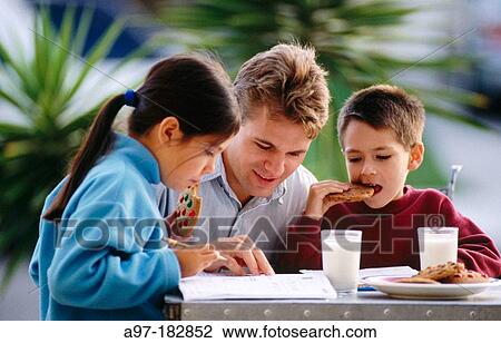 Dad helps kids with homework View Large Photo Image Stock Image - Dad helps kids with homework. Fotosearch