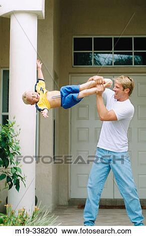 dad swinging his son View Large Photo Image Stock Image - dad swinging his son. Fotosearch