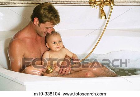 dad with baby in bath tub View Large Photo Image Picture - dad with baby in bath tub. Fotosearch