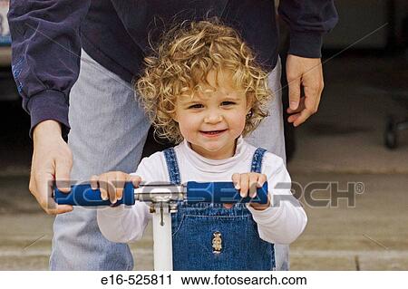 Dad with daughter on skate toy View Large Photo Image Stock Image - Dad with daughter on skate toy. Fotosearch