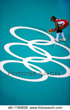 Stock Photo - Daimi Ramirez of Cuba prepares to serve againts U S in the women's volleyball semifinal during the 2008 Beijing Olympics.. Fotosearch