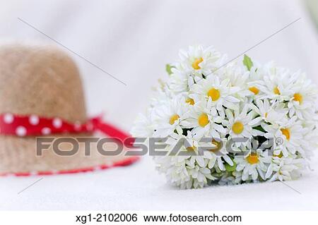 Daisies and hat. View Large Photo Image Stock Photograph - Daisies and hat.. Fotosearch