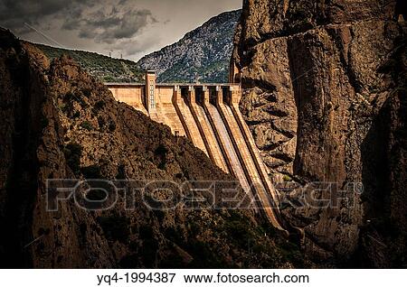 Stock Photo - Dam of Escales lake, in which we see a stair carved in the rock. Lleida, Catalonia, Spain.. Fotosearch