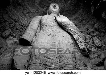 Damaged Buddha statue carved inside the ancient Yungang Grottoes, Datong, Shanxi, China. View Large Photo Image Stock Photograph - Damaged Buddha statue carved inside the ancient Yungang Grottoes, Datong, Shanxi, China.. Fotosearch