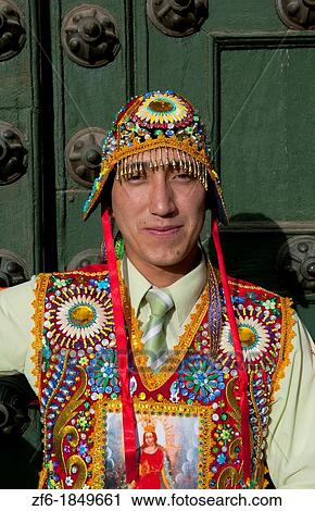 Stock Image - Dancer in native costume colorful beads in Main Square in Cusco Cuzco Peru. Fotosearch