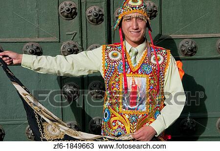 Stock Image - Dancer in native costume colorful beads in Main Square in Cusco Cuzco Peru. Fotosearch