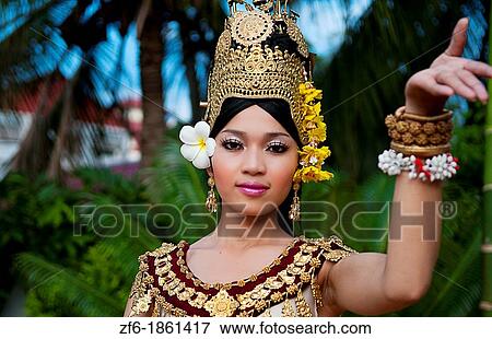 Dancer in native traditional gold ancient dance costume in Siem Reap Cambodia Asia View Large Photo Image Stock Photo - Dancer in native traditional gold ancient dance costume in Siem Reap Cambodia Asia. Fotosearch