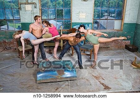 Dancers posing in an old factory View Large Photo Image Picture - Dancers posing in an old factory. Fotosearch