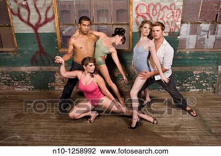 Dancers posing in an old factory View Large Photo Image Stock Image - Dancers posing in an old factory. Fotosearch