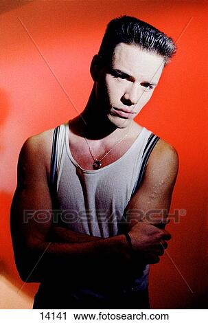 Dangerous young man in a T-shirt View Large Photo Image Stock Image - Dangerous young man in a T-shirt. Fotosearch
