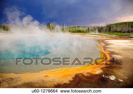 Dark clouds from a summer thunderstorm pass over black sand geyser basin in Yellowstone national park, wyoming View Large Photo Image Picture - Dark clouds from a summer thunderstorm pass over black sand geyser basin in Yellowstone national park, wyoming. Fotosearch