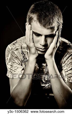 Stock Image - Dark portrait of hopeless teenager. Fotosearch