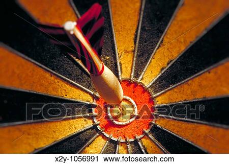 Dart in bulls eye of a dart board View Large Photo Image Stock Image - Dart in bulls eye of a dart board. Fotosearch