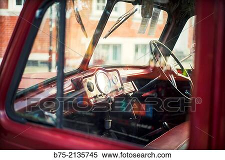 Dashboard of a vintage car seen through the window in a street in London, England, UK, Europe View Large Photo Image Stock Photography - Dashboard of a vintage car seen through the window in a street in London, England, UK, Europe. Fotosearch