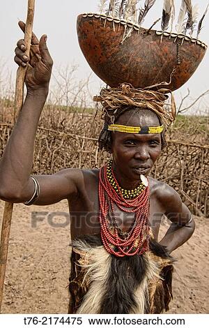 Dassanech woman with a gourd on her head, Lower Omo Valley of Ethiopia. View Large Photo Image Stock Photography - Dassanech woman with a gourd on her head, Lower Omo Valley of Ethiopia.. Fotosearch