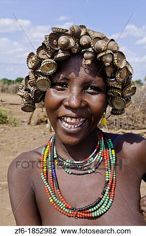 Dassnech Tribe in Omorate Ethiopia Africa Lower Omo Valley wife portrait in village with headress 26 View Large Photo Image Stock Image - Dassnech Tribe in Omorate Ethiopia Africa Lower Omo Valley wife portrait in village with headress 26. Fotosearch