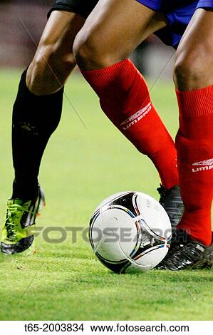 Picture - Date: 12-9-2012. Lugo Cup match CD Lugo - Racing Santander. Two players fight for the ball.. Fotosearch