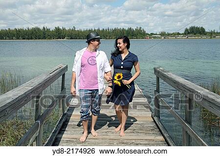 Dating couples lakeside park in Hialeah Amelia, Florida USA View Large Photo Image Stock Photograph - Dating couples lakeside park in Hialeah Amelia, Florida USA. Fotosearch