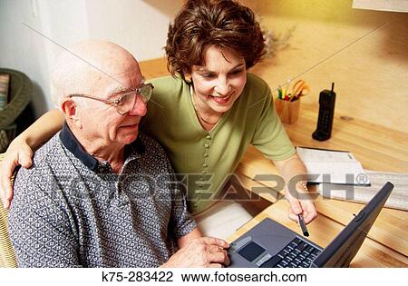 Daughter teaching senior to use computer View Large Photo Image Stock Image - Daughter teaching senior to use computer. Fotosearch