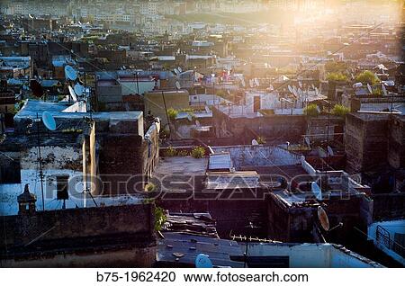 Stock Image - Dawn in Fez, Morocco, Africa. General view from a rooftop.. Fotosearch