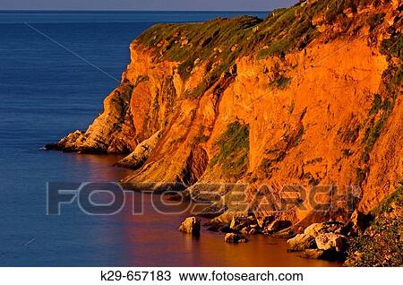 Dawn light on cliffs at Cap Canon. Gasp? sie, Quebec, Canada View Large Photo Image Stock Image - Dawn light on cliffs at Cap Canon. Gasp? sie, Quebec, Canada. Fotosearch