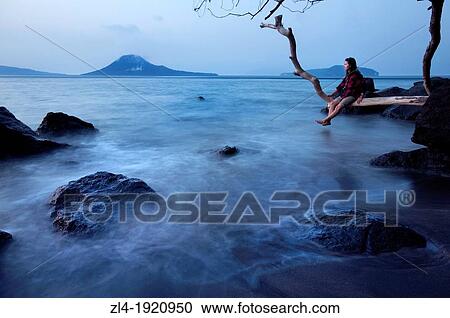 Stock Image - Dawn over Krakatau volcano. Indonesia, Java, Jawa Barat, Krakatau. Model Released. (/Julien Garcia). Fotosearch