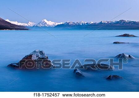 Dawn over Lake Pukaki and Mount Cook, 3754m/12315ft, Southern Alps, New Zealand View Large Photo Image Stock Photo - Dawn over Lake Pukaki and Mount Cook, 3754m/12315ft, Southern Alps, New Zealand. Fotosearch