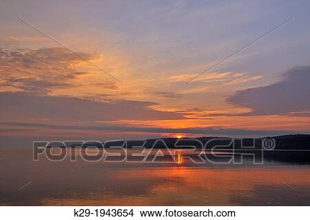 Dawn skies over Munising Bay, Munising, Michigan, Canada. View Large Photo Image Picture - Dawn skies over Munising Bay, Munising, Michigan, Canada.. Fotosearch
