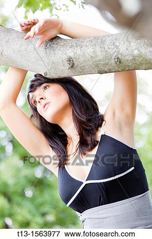 Daydreaming in the park young woman View Large Photo Image Stock Photo - Daydreaming in the park young woman. Fotosearch