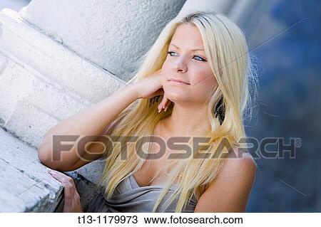 Daydreaming young woman with beautiful Blue eyes View Large Photo Image Stock Image - Daydreaming young woman with beautiful Blue eyes. Fotosearch