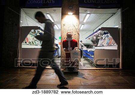 Stock Image - December 31st 2012, Barcelona, Spain Boqueria Market in the center of the city Opening the shops for en year sales, at 6 am. Fotosearch