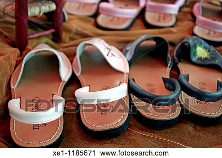 Stock Image - decorated sandals. Fotosearch