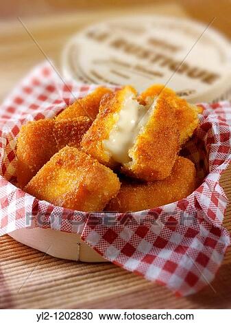 Stock Image - Deep fried breaded Camembert cheese recipe. Fotosearch