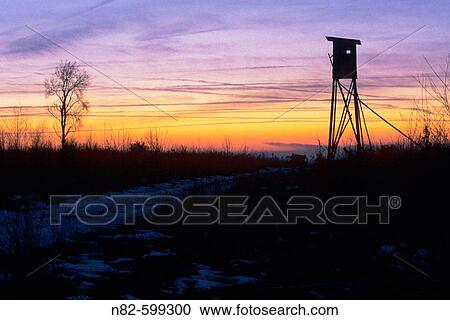 Deerstand at sunset in Franconia _ Bavaria/Germany. View Large Photo Image Stock Image - Deerstand at sunset in Franconia _ Bavaria/Germany.. Fotosearch