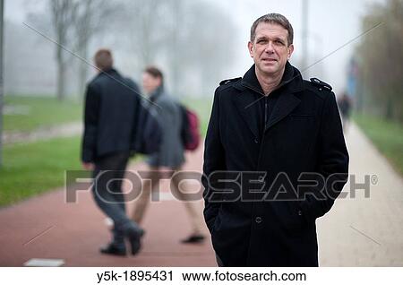 Delft, Netherlands. A man in suit, being a researcher on a university, portrayed for a magazine. View Large Photo Image Stock Image - Delft, Netherlands. A man in suit, being a researcher on a university, portrayed for a magazine.. Fotosearch