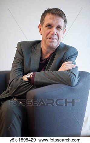 Delft, Netherlands. A man in suit, being a researcher on a university, portrayed for a magazine. View Large Photo Image Stock Photo - Delft, Netherlands. A man in suit, being a researcher on a university, portrayed for a magazine.. Fotosearch