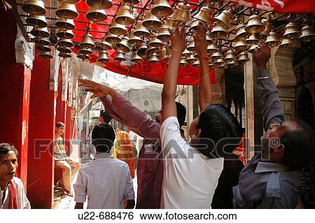 Delhi, India: people shaking ritual bells at the Kalkaji Temple View Large Photo Image Stock Photograph - Delhi, India: people shaking ritual bells at the Kalkaji Temple. Fotosearch