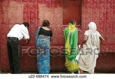 Delhi, India: people washing their hands before entering the Kalkaji Temple View Large Photo Image Picture - Delhi, India: people washing their hands before entering the Kalkaji Temple. Fotosearch