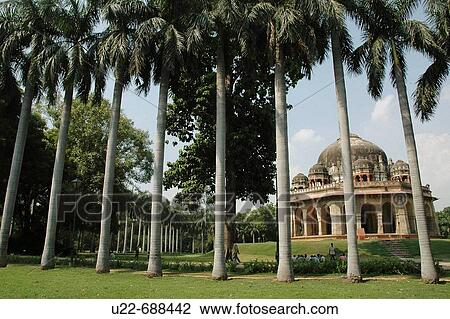 Stock Image - Delhi, India: the Lodi Garden and the Bara Gumbad building. Fotosearch